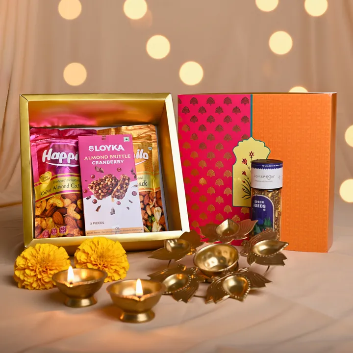 Urli of Happiness Hamper, a Diwali gift hamper with Happilo Cajun Almond Cashew Mix, Happilo Party Snack and Loyka Almond Brittle